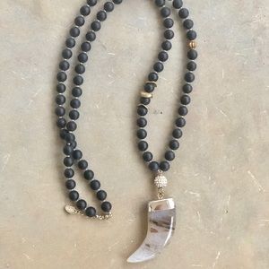 Handmade beaded necklace with horn accent